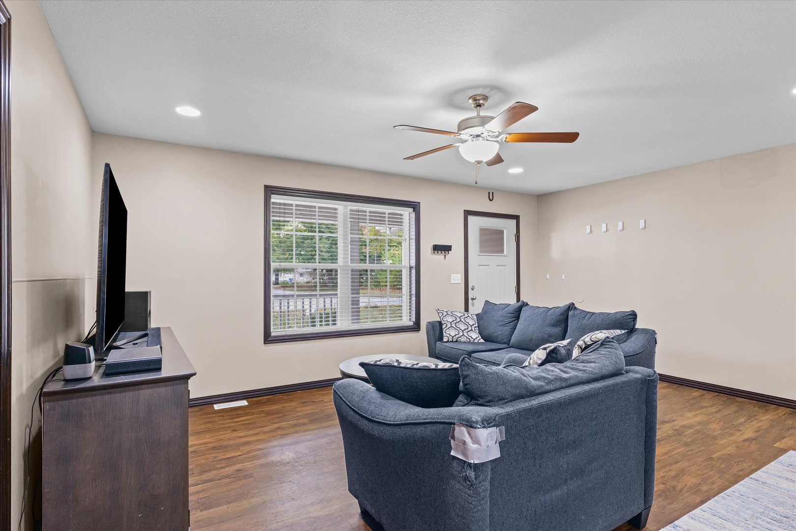 601 Curtis Road Ogden, IL 61859 - Photo 6 of 29 a living room with furniture and a flat screen tv