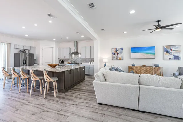 a large kitchen with a table and chairs