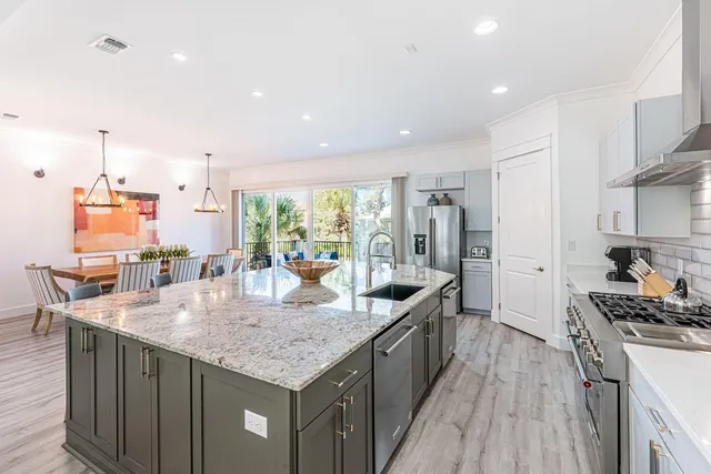 a kitchen with counter top space cabinets and stainless steel appliances