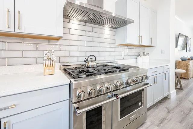 a living room with furniture and painting on the wall