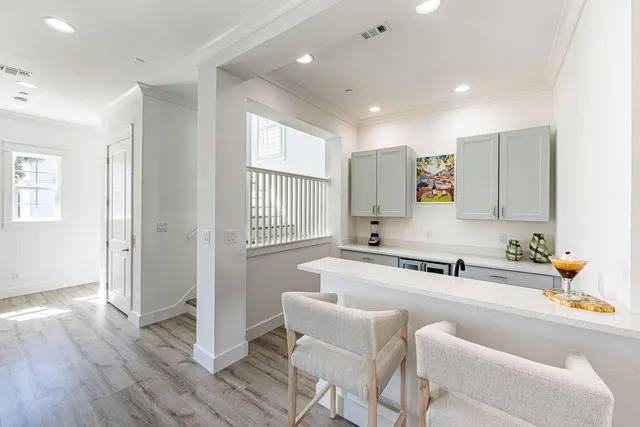 a view of a patio with a table chairs and a backyard