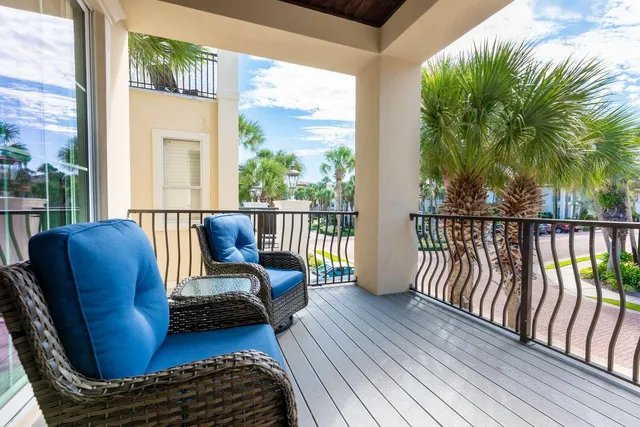 a white bath tub sitting in a bathroom next to a window