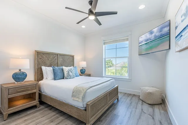 an aerial view of residential houses with outdoor space and ocean view