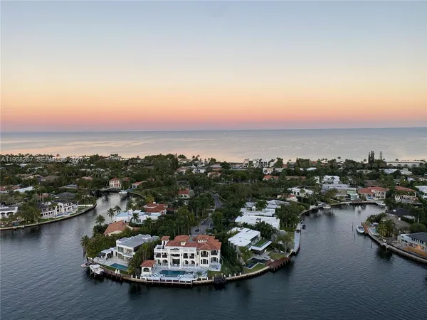 an aerial view of a house with a ocean view