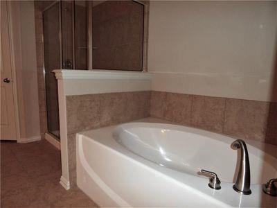 5321 Locust Drive McKinney, TX 75070 - Photo 14 of 17 a bath tub sitting in a bathroom