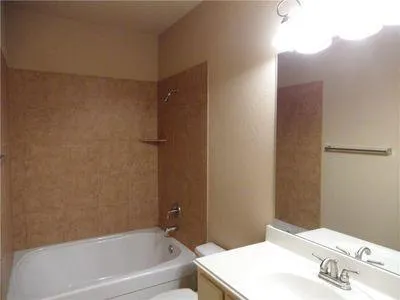 a bathroom with a bathtub and shower