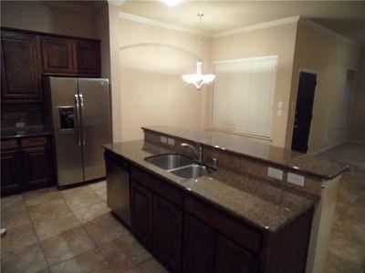 5321 Locust Drive McKinney, TX 75070 - Photo 5 of 17 a bathroom with a granite countertop sink a mirror and a shower
