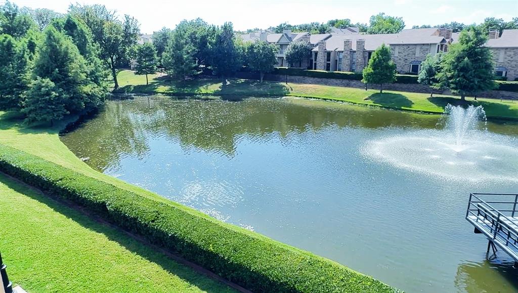 14277 Preston Road, Unit 923 Dallas, TX 75254 - Photo 1 of 39 a view of swimming pool with a yard and large trees