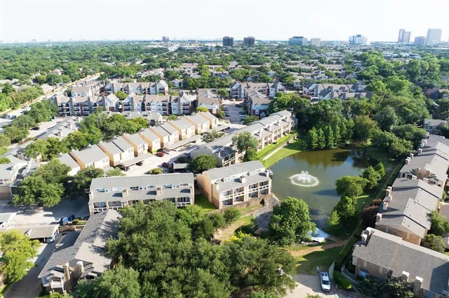 an aerial view of a city with lots of residential buildings
