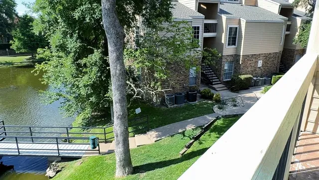 a view of a backyard with potted plants