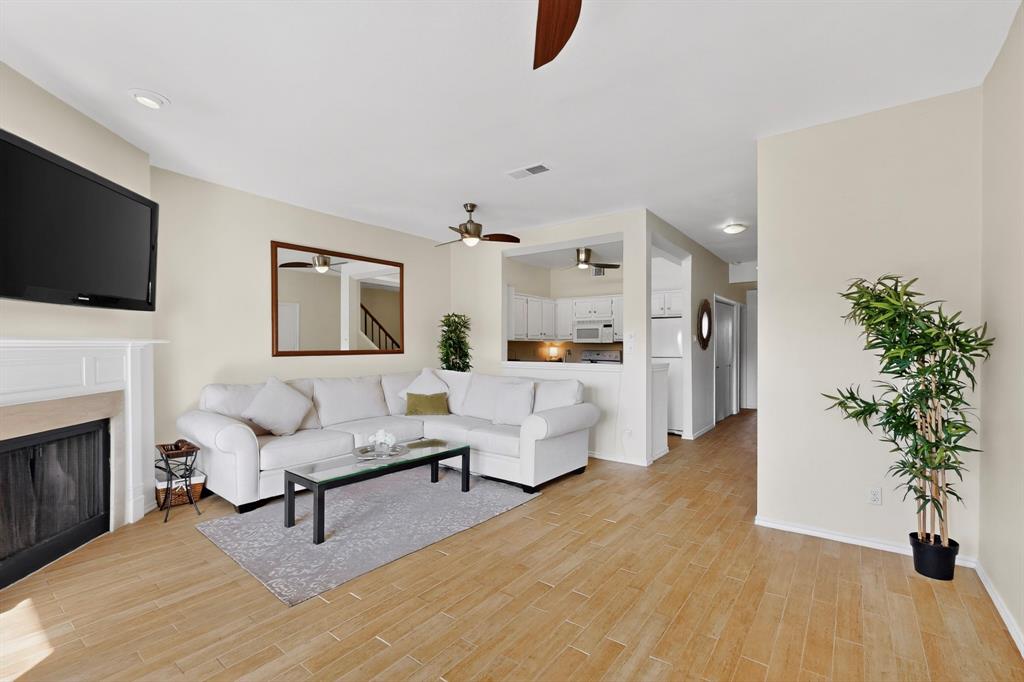 14277 Preston Road, Unit 923 Dallas, TX 75254 - Photo 16 of 39 a living room with furniture and a fireplace