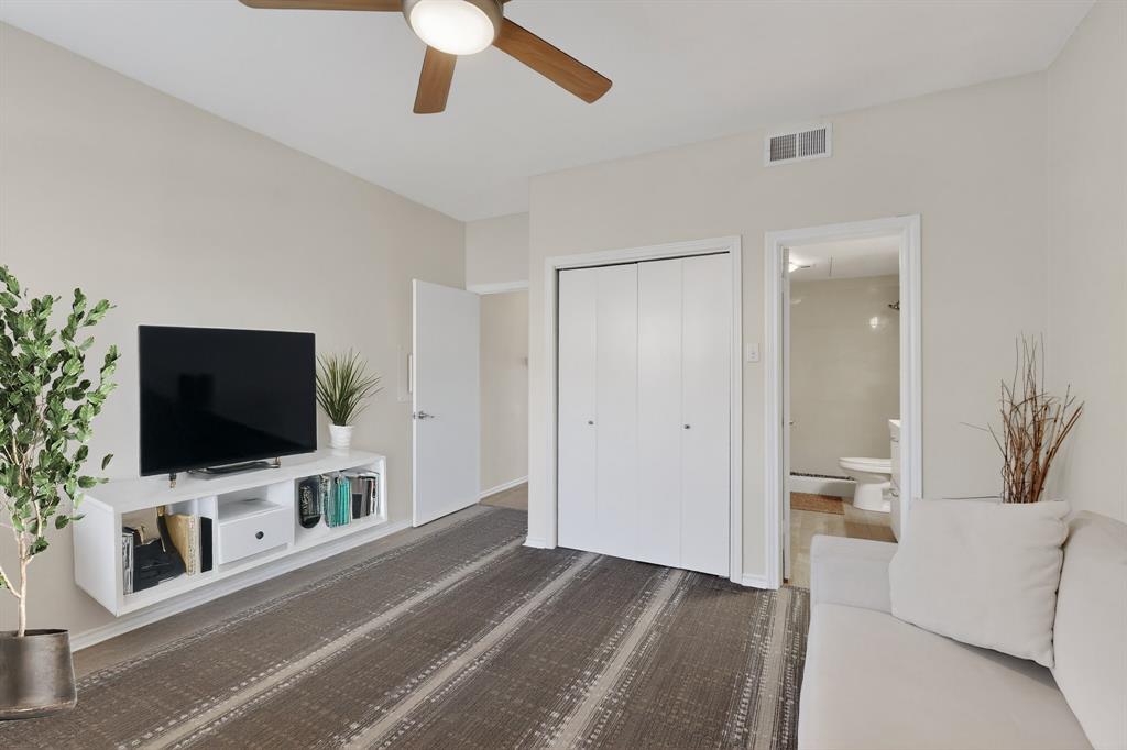 14277 Preston Road, Unit 923 Dallas, TX 75254 - Photo 20 of 39 a view of a livingroom with furniture and a flat screen tv