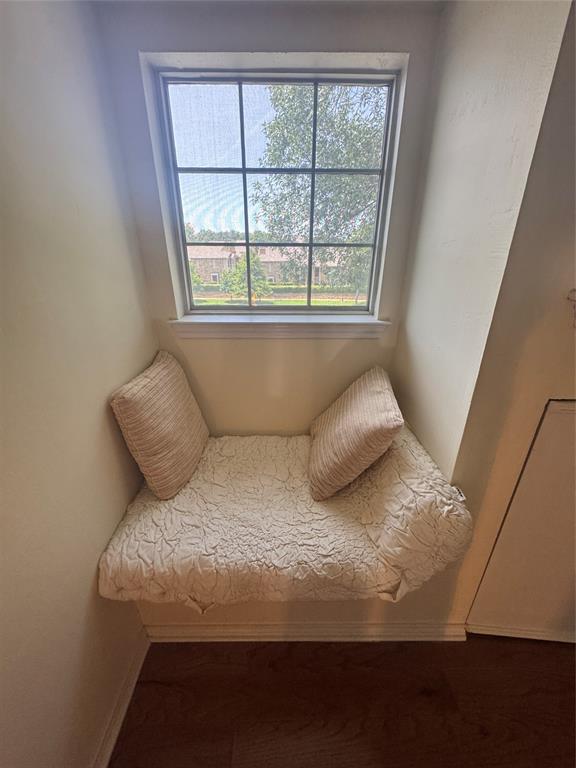 14277 Preston Road, Unit 923 Dallas, TX 75254 - Photo 26 of 39 a bed sitting in a bedroom next to a window