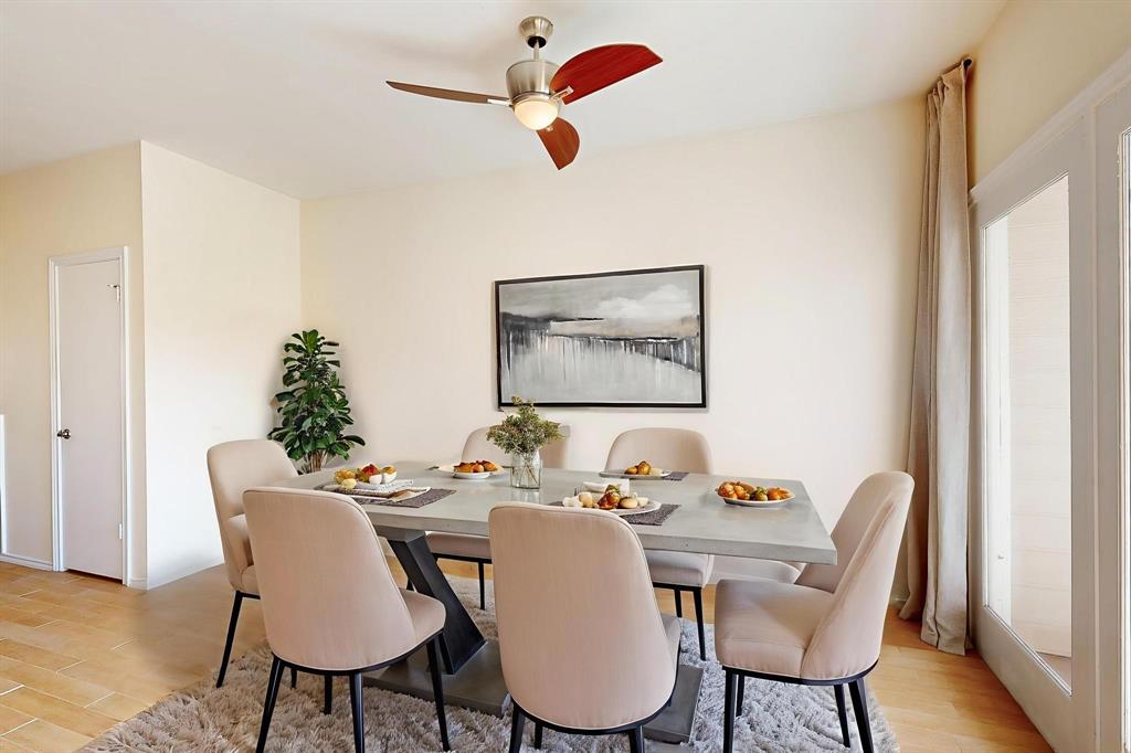 14277 Preston Road, Unit 923 Dallas, TX 75254 - Photo 7 of 39 a dining room with furniture a potted plant and wooden floor