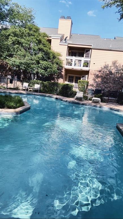 14277 Preston Road, Unit 923 Dallas, TX 75254 - Photo 10 of 39 a swimming pool with outdoor seating and yard