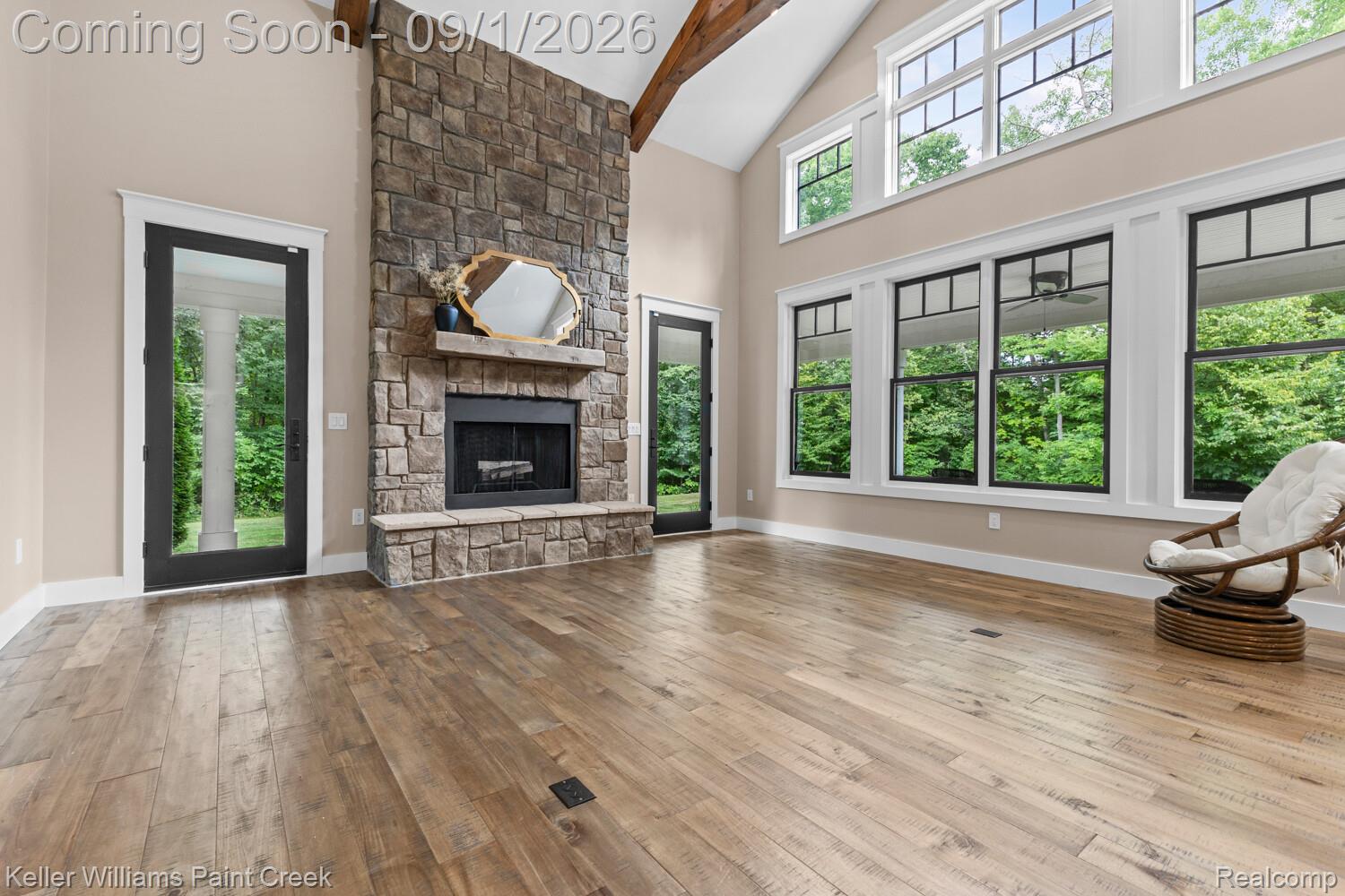 66927 Campground Road Washington, MI 48095 - Photo 14 of 60 Great Room view 2, Beautiful Stone fireplace, 2 French doors on either side leading to covered wrap around porch