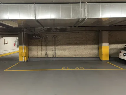 a bathroom with a shower and a sink