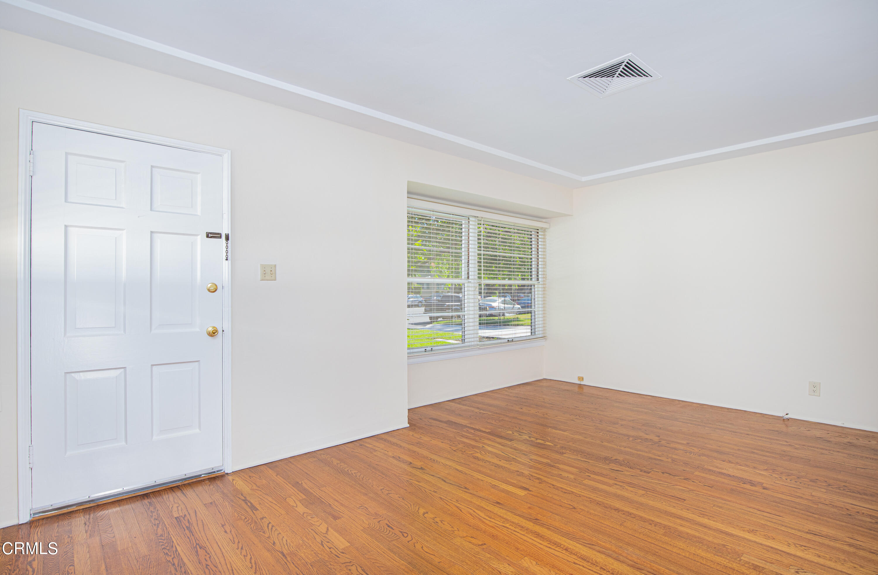 1564 Riverside Drive Glendale, CA 91201 - Photo 5 of 22 a view of empty room with wooden floor and fan