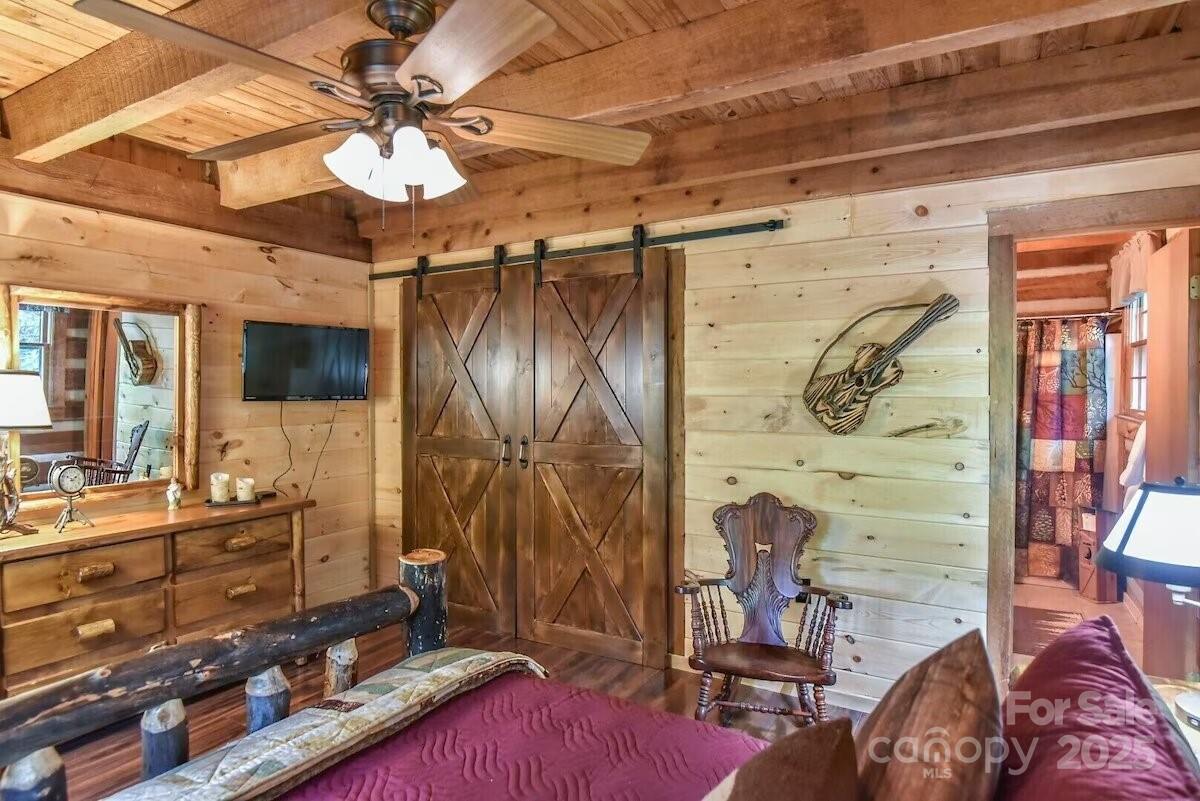 48 Buck Ridge Road Fairview, NC 28730 - Photo 13 of 38 a living room with furniture and a flat screen tv