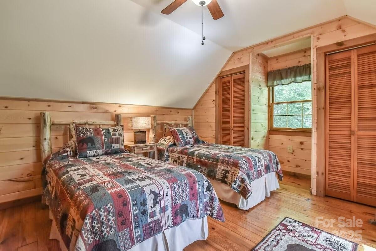 48 Buck Ridge Road Fairview, NC 28730 - Photo 18 of 38 a bedroom with two beds and a window