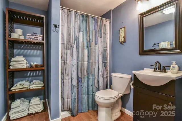 a spacious bedroom with two beds and windows