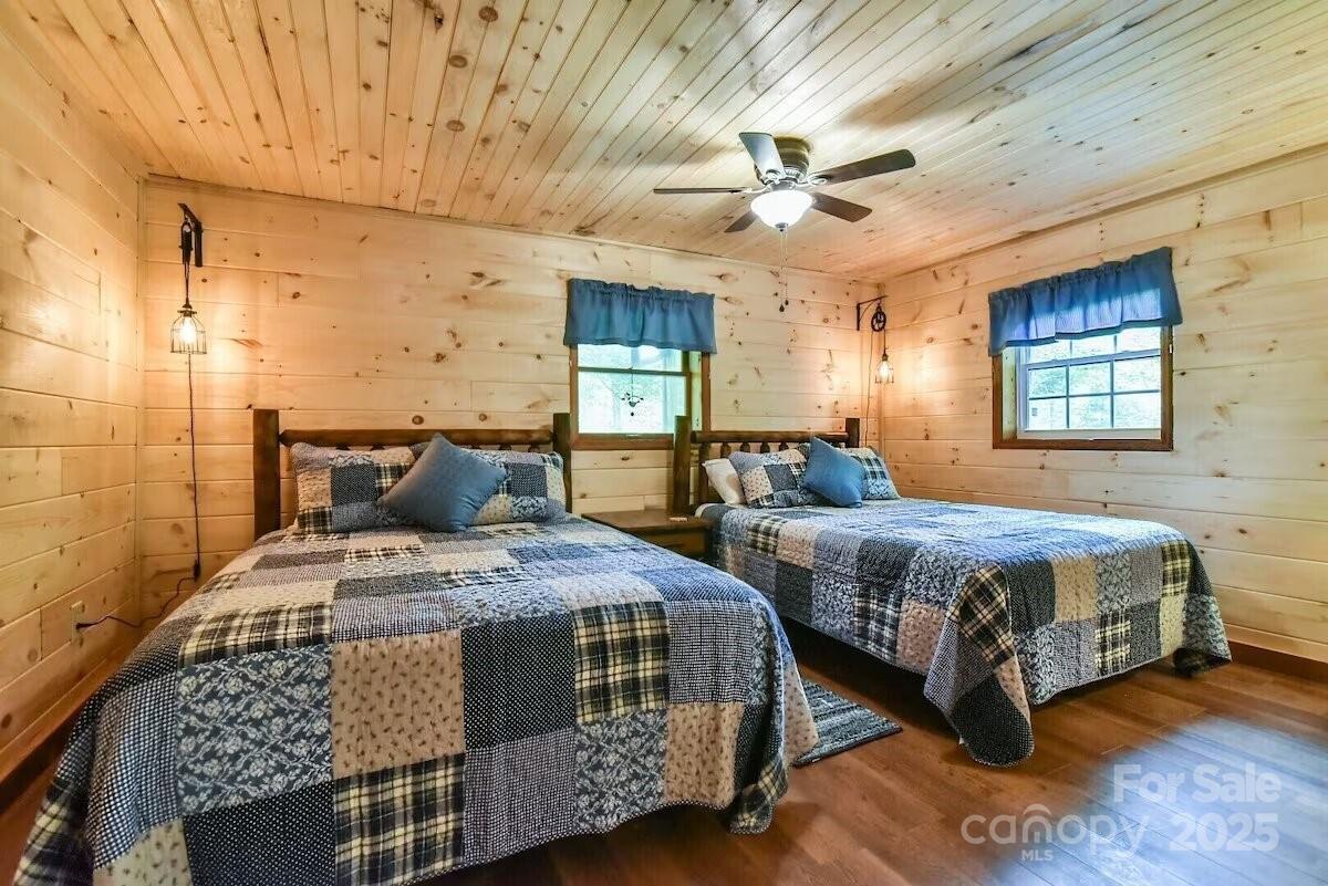 48 Buck Ridge Road Fairview, NC 28730 - Photo 20 of 38 a spacious bedroom with two beds and windows