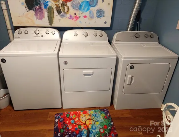 a wooden bench sitting in a yard next to a yard
