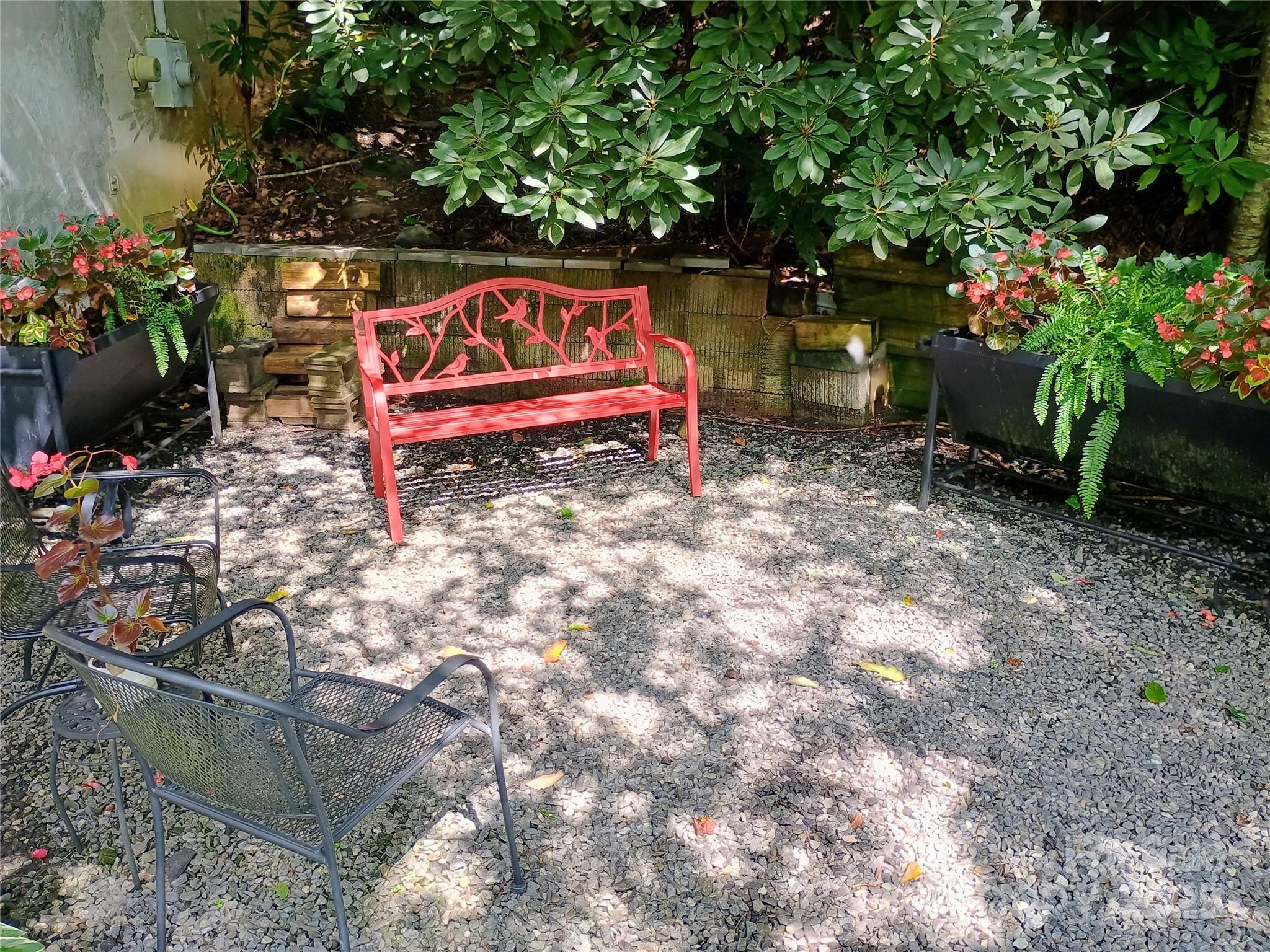 48 Buck Ridge Road Fairview, NC 28730 - Photo 28 of 38 a wooden bench sitting in a yard next to a yard