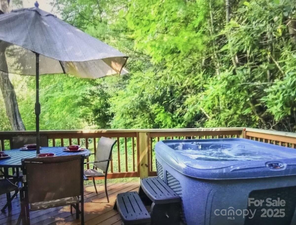48 Buck Ridge Road Fairview, NC 28730 - Photo 29 of 38 a view of a chairs and table in backyard