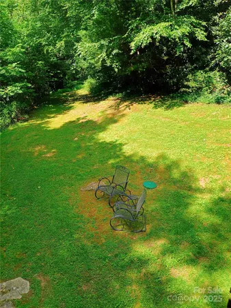 a view of yard with swimming pool