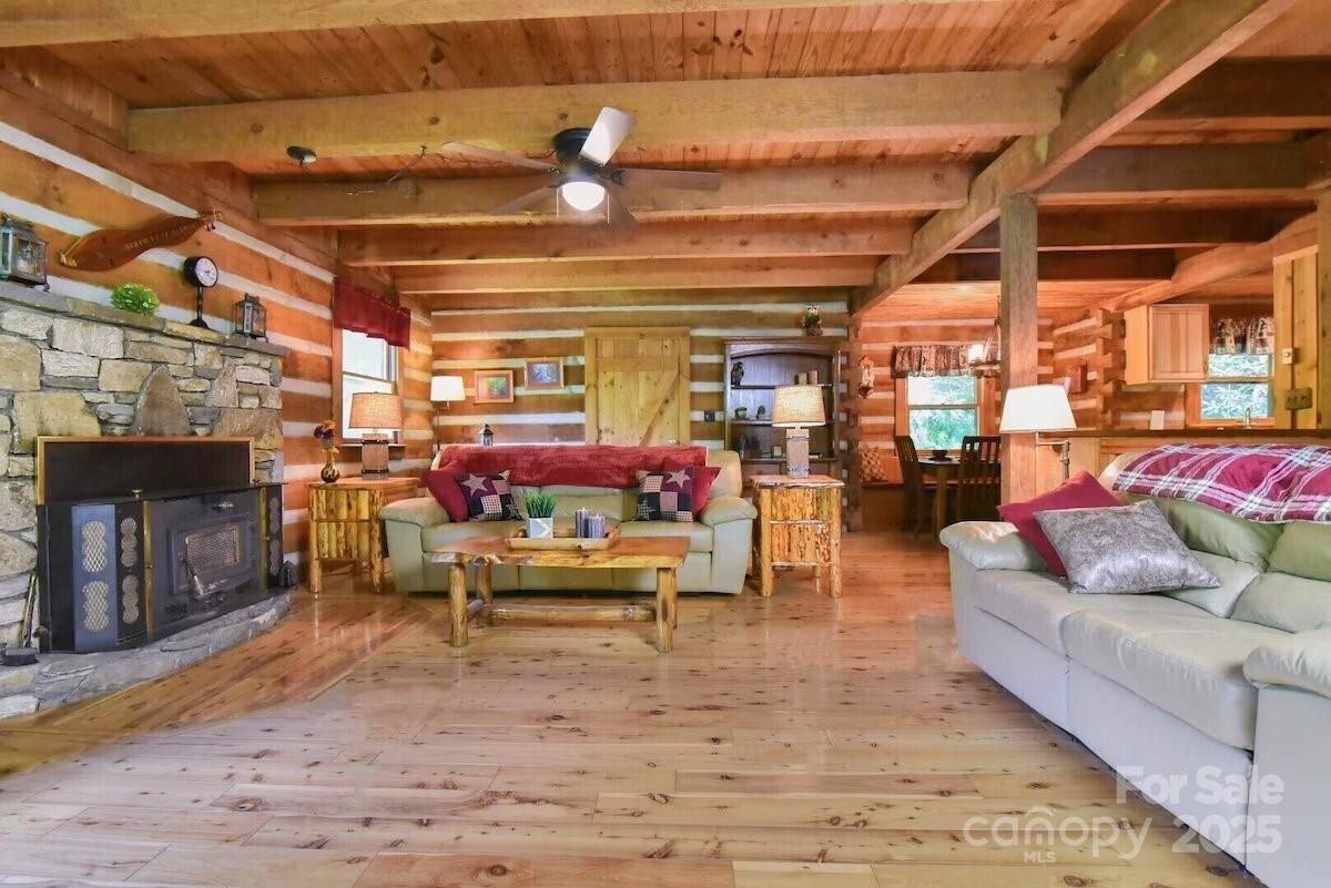 48 Buck Ridge Road Fairview, NC 28730 - Photo 6 of 38 a living room with furniture and a fireplace