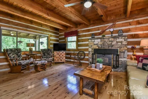 a living room with lots of furniture and a fireplace