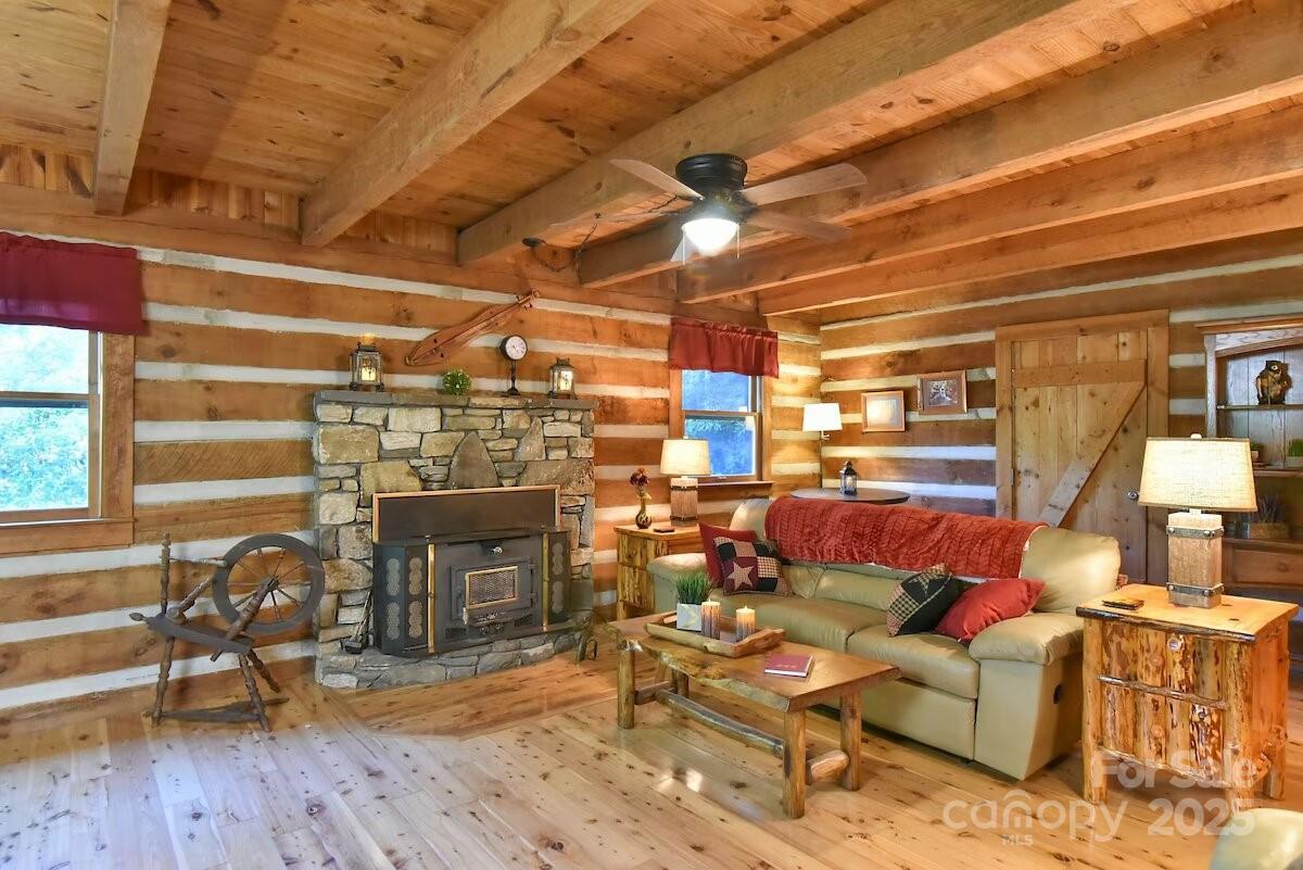 48 Buck Ridge Road Fairview, NC 28730 - Photo 8 of 38 a living room with lots of furniture and a fireplace