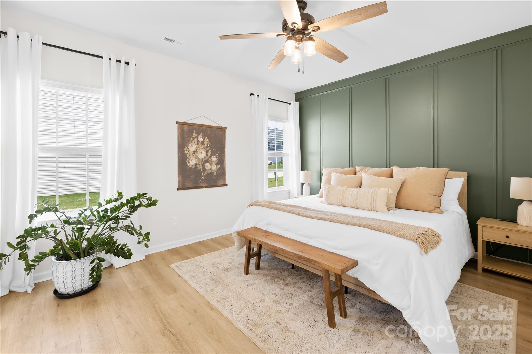 3110 Streamside Drive Davidson, NC 28036 - Photo 15 of 39 a bedroom with a bed and a chandelier