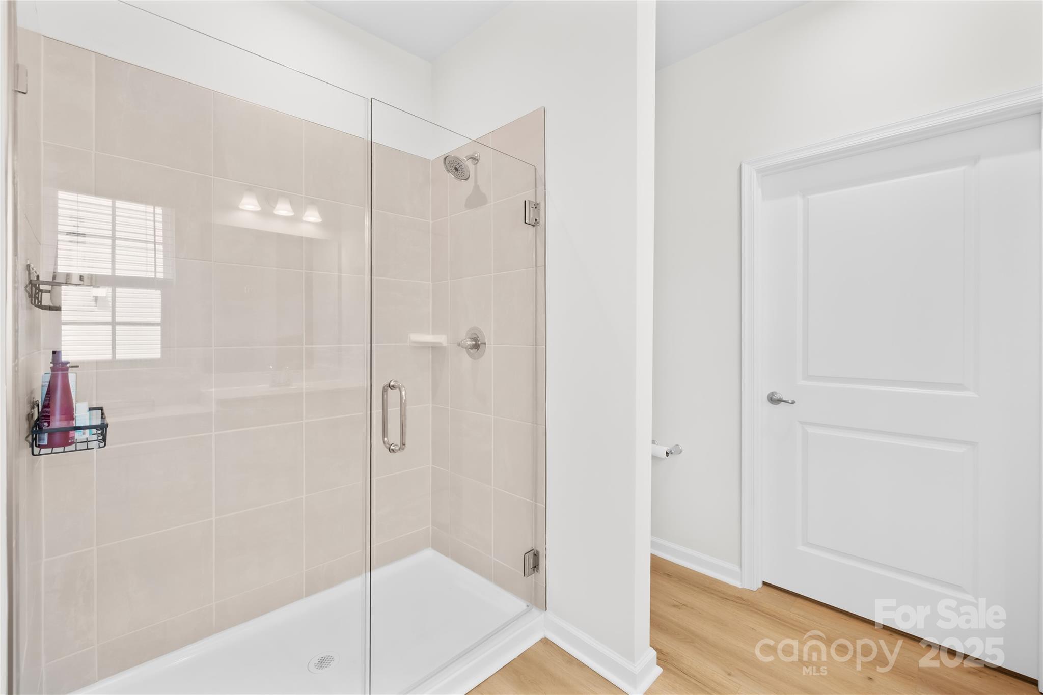 3110 Streamside Drive Davidson, NC 28036 - Photo 17 of 39 a bathroom with a shower and a bath tub