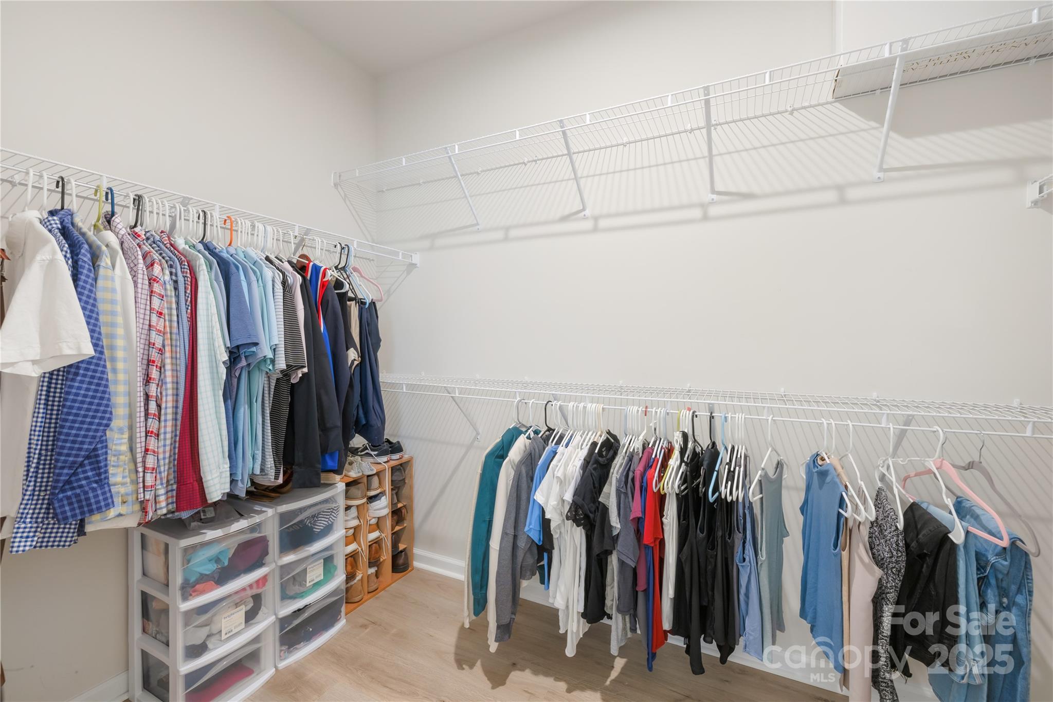 3110 Streamside Drive Davidson, NC 28036 - Photo 18 of 39 a view of walk in closet with clothes