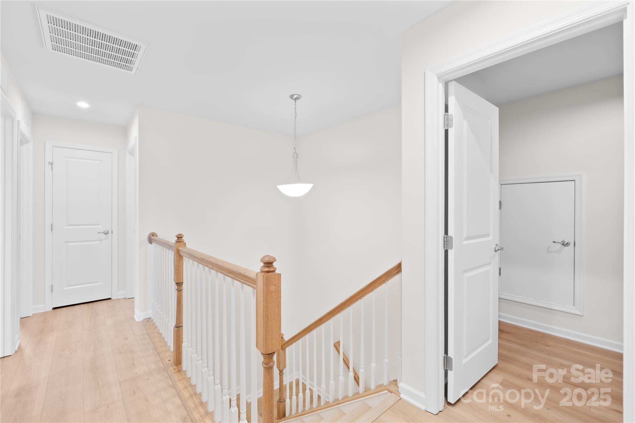 3110 Streamside Drive Davidson, NC 28036 - Photo 21 of 39 a view of a hallway with staircase