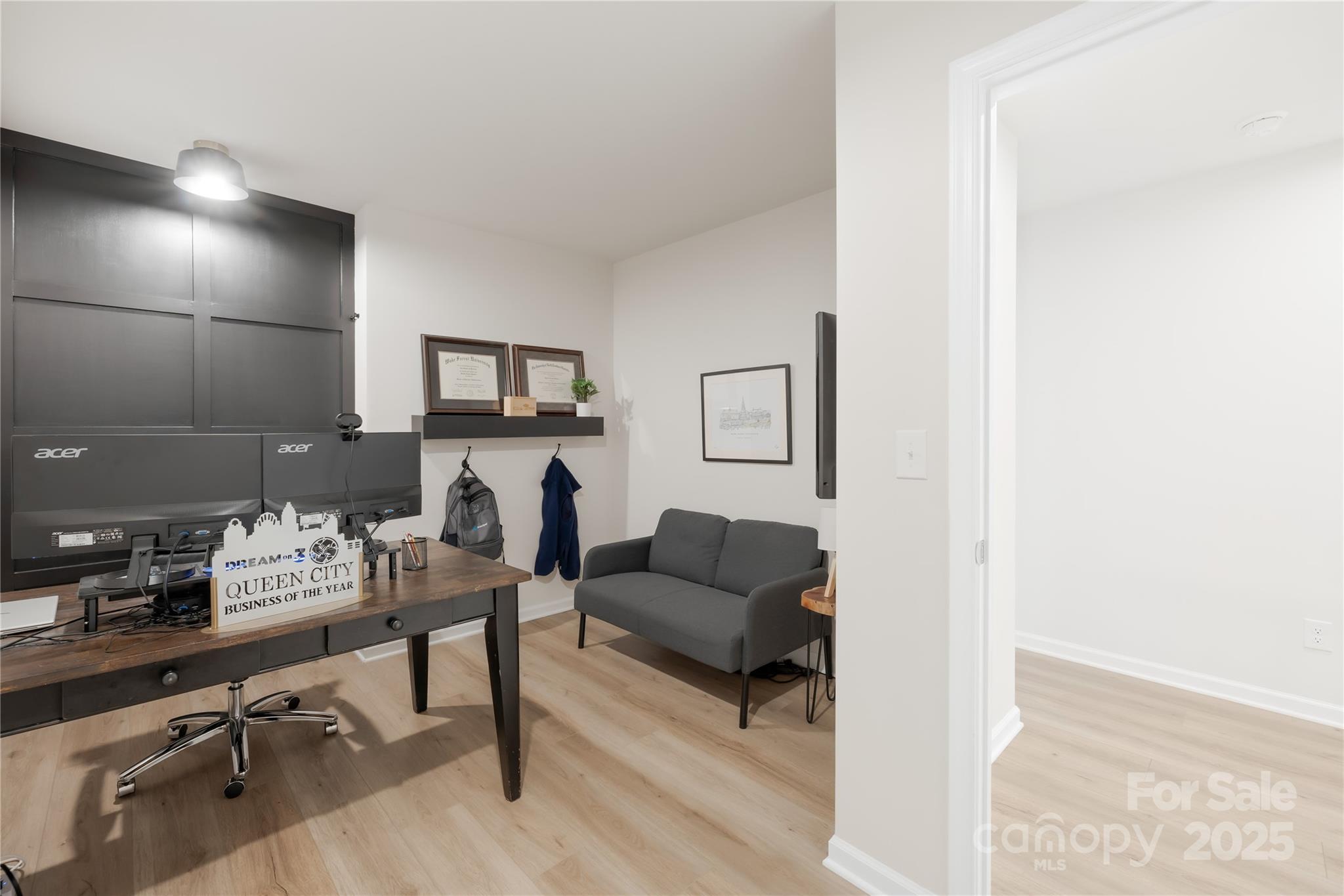 3110 Streamside Drive Davidson, NC 28036 - Photo 22 of 39 a work room with furniture and a wooden floor