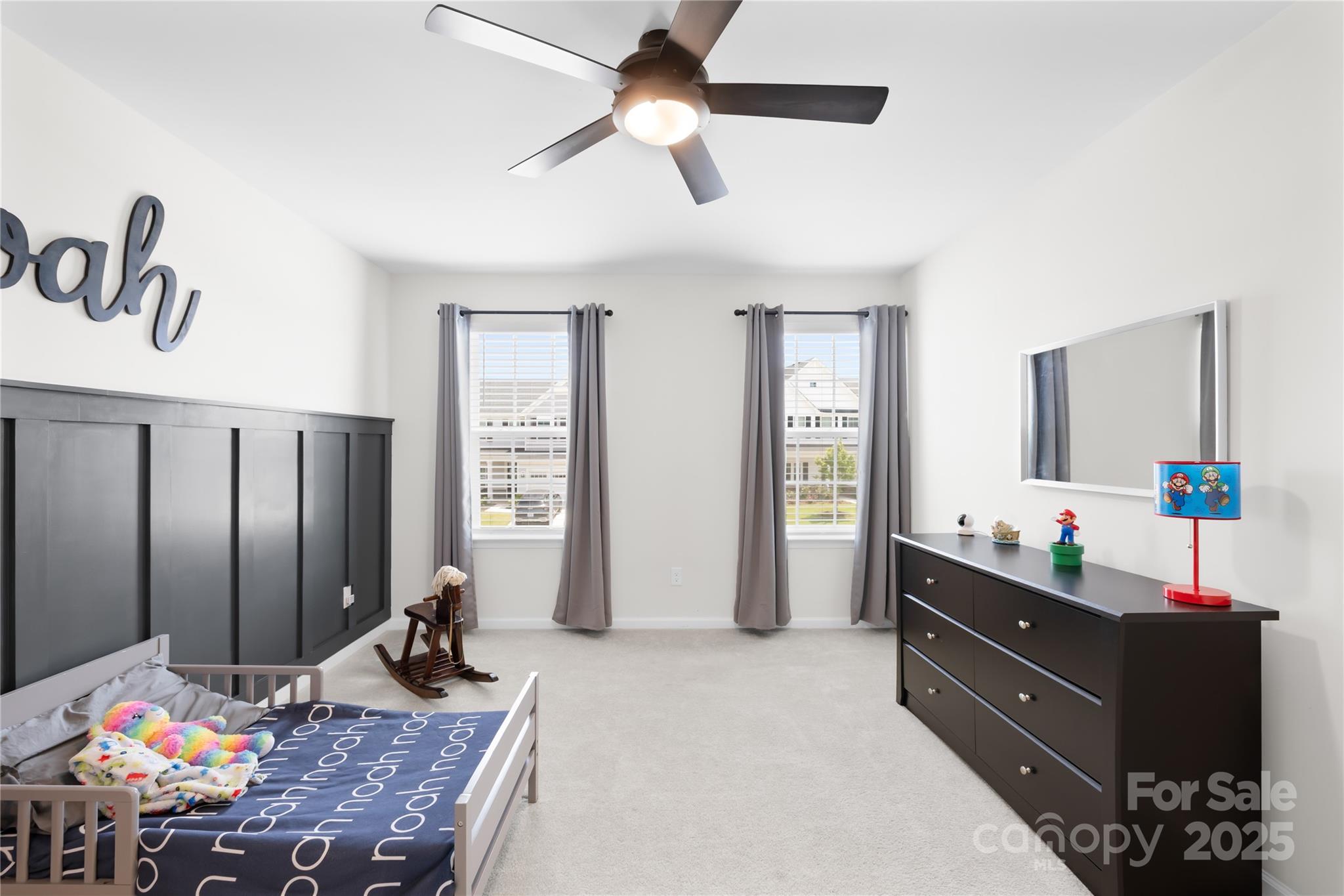 3110 Streamside Drive Davidson, NC 28036 - Photo 23 of 39 a bedroom with a bed and a dresser