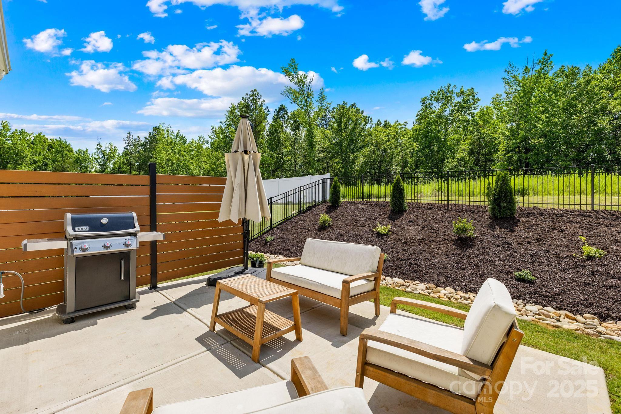 3110 Streamside Drive Davidson, NC 28036 - Photo 27 of 39 a view of a backyard with chairs
