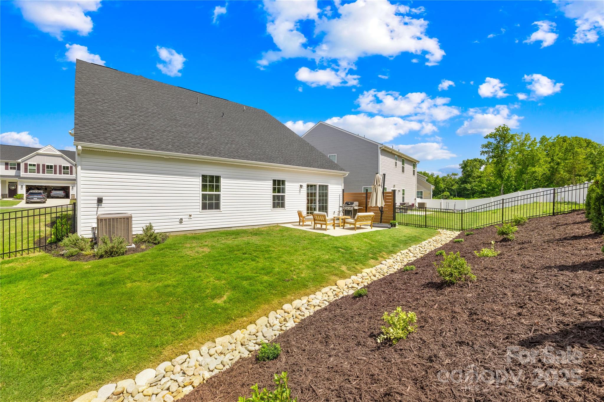 3110 Streamside Drive Davidson, NC 28036 - Photo 30 of 39 a view of a house with backyard and sitting area