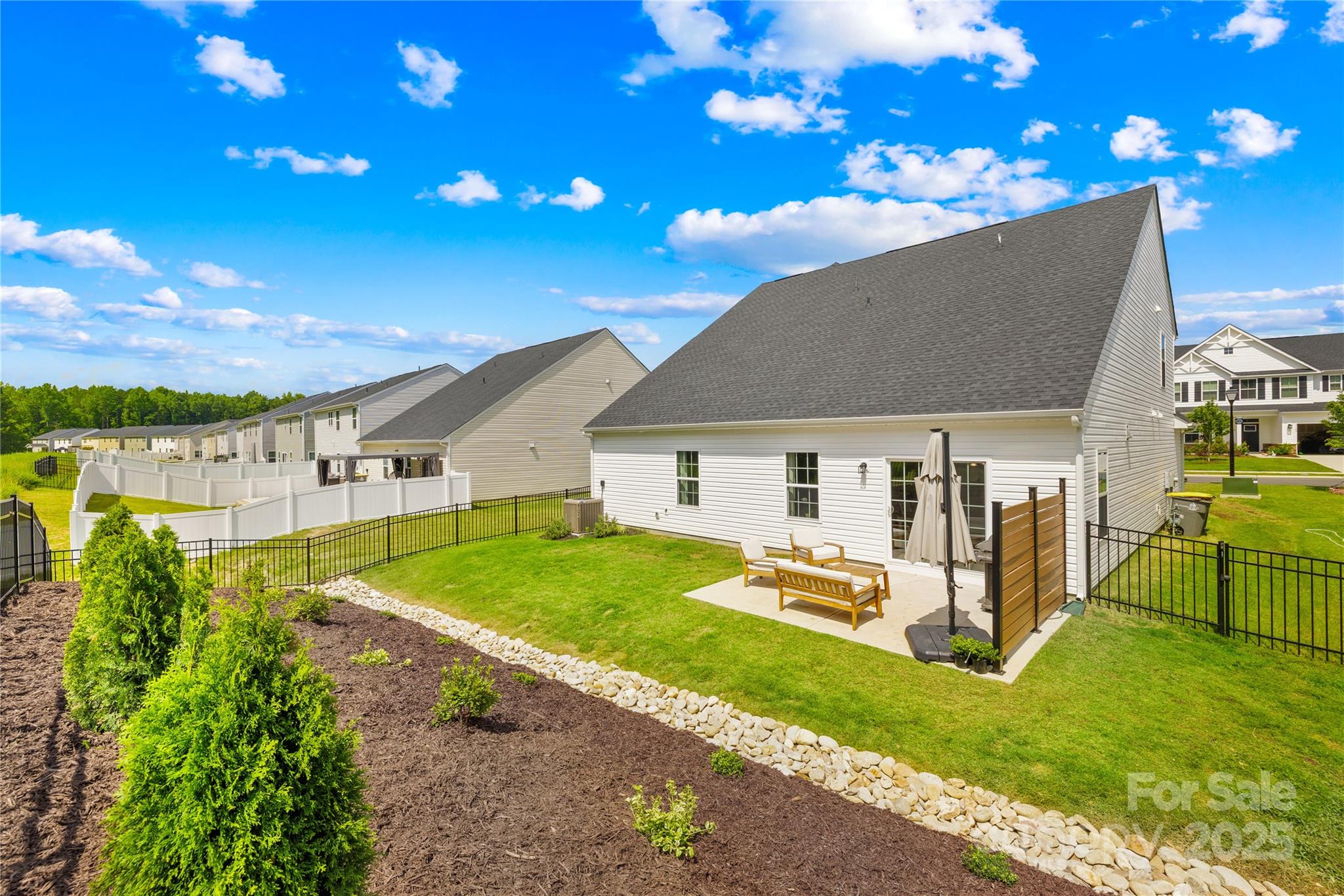 3110 Streamside Drive Davidson, NC 28036 - Photo 31 of 39 a view of a house with a backyard porch and sitting area