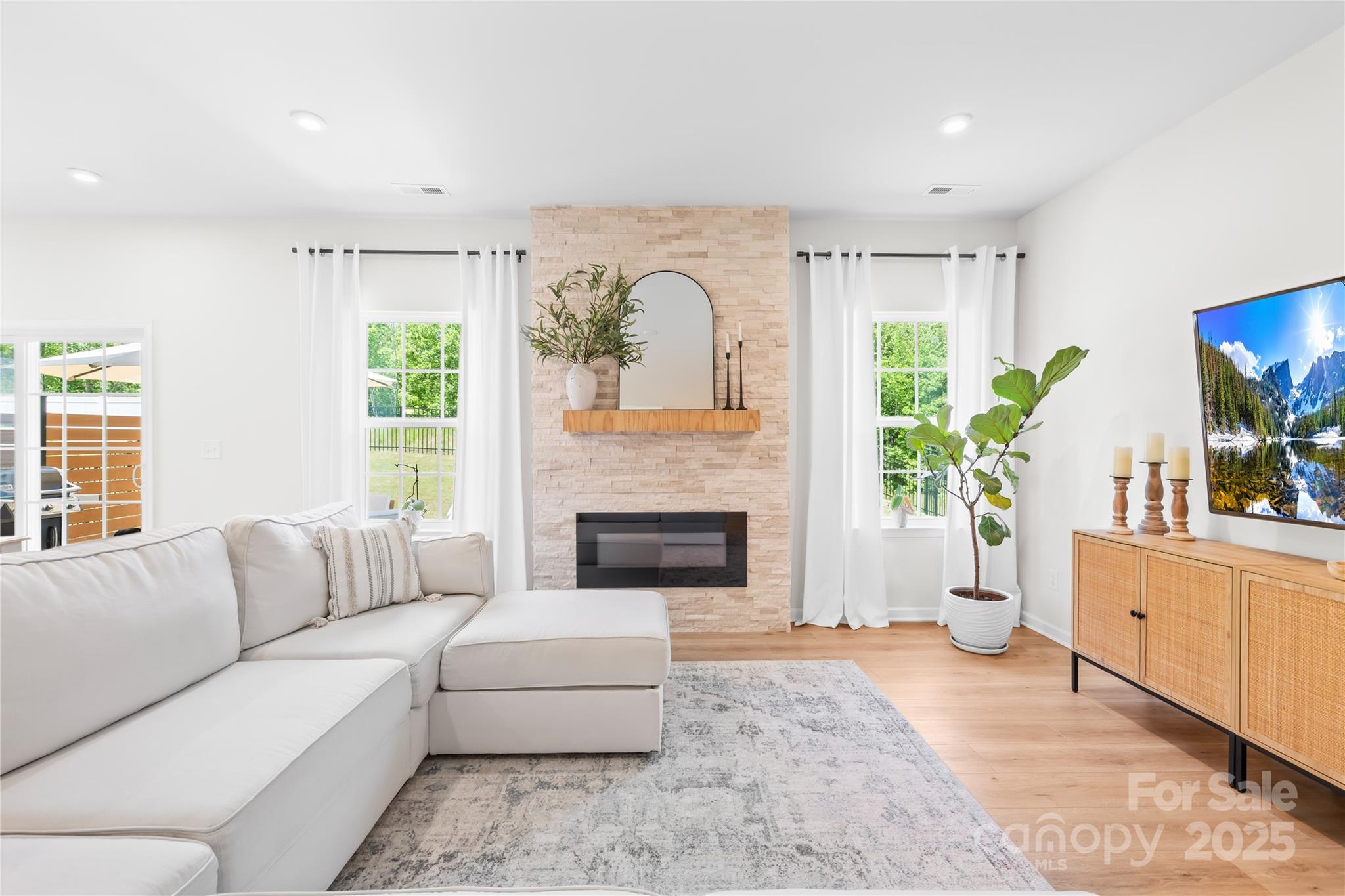3110 Streamside Drive Davidson, NC 28036 - Photo 5 of 39 a living room with furniture and a fireplace