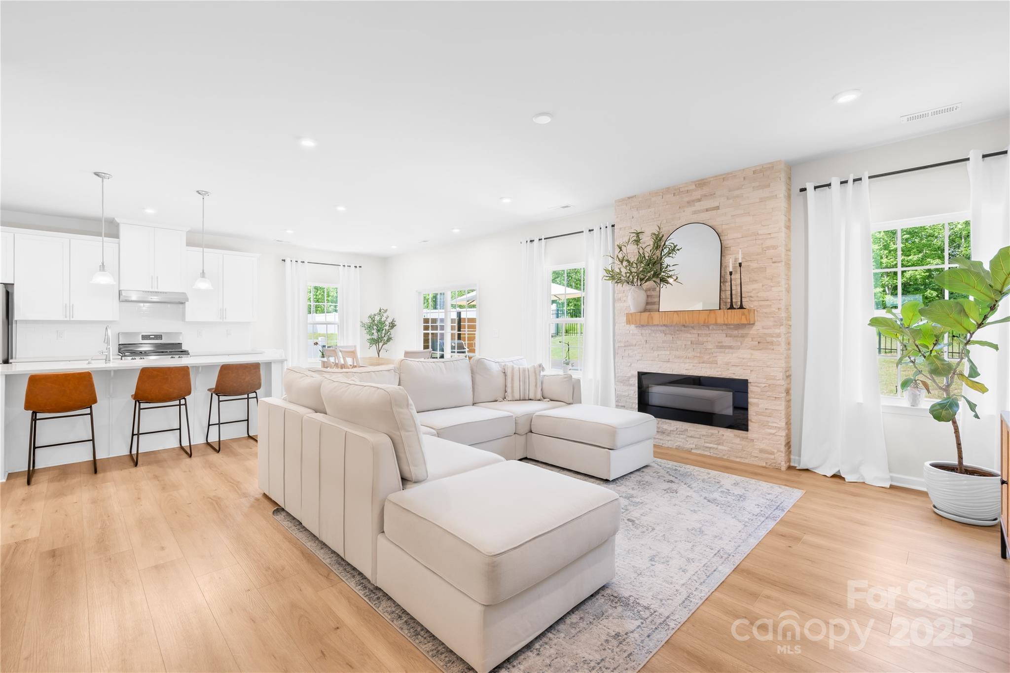 3110 Streamside Drive Davidson, NC 28036 - Photo 6 of 39 a living room with furniture and a fireplace