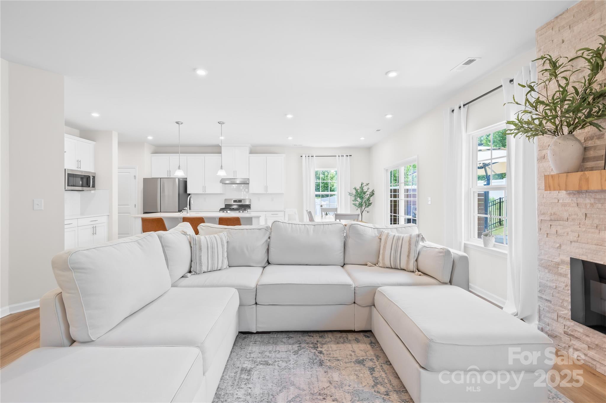 3110 Streamside Drive Davidson, NC 28036 - Photo 7 of 39 a living room with furniture and a fireplace
