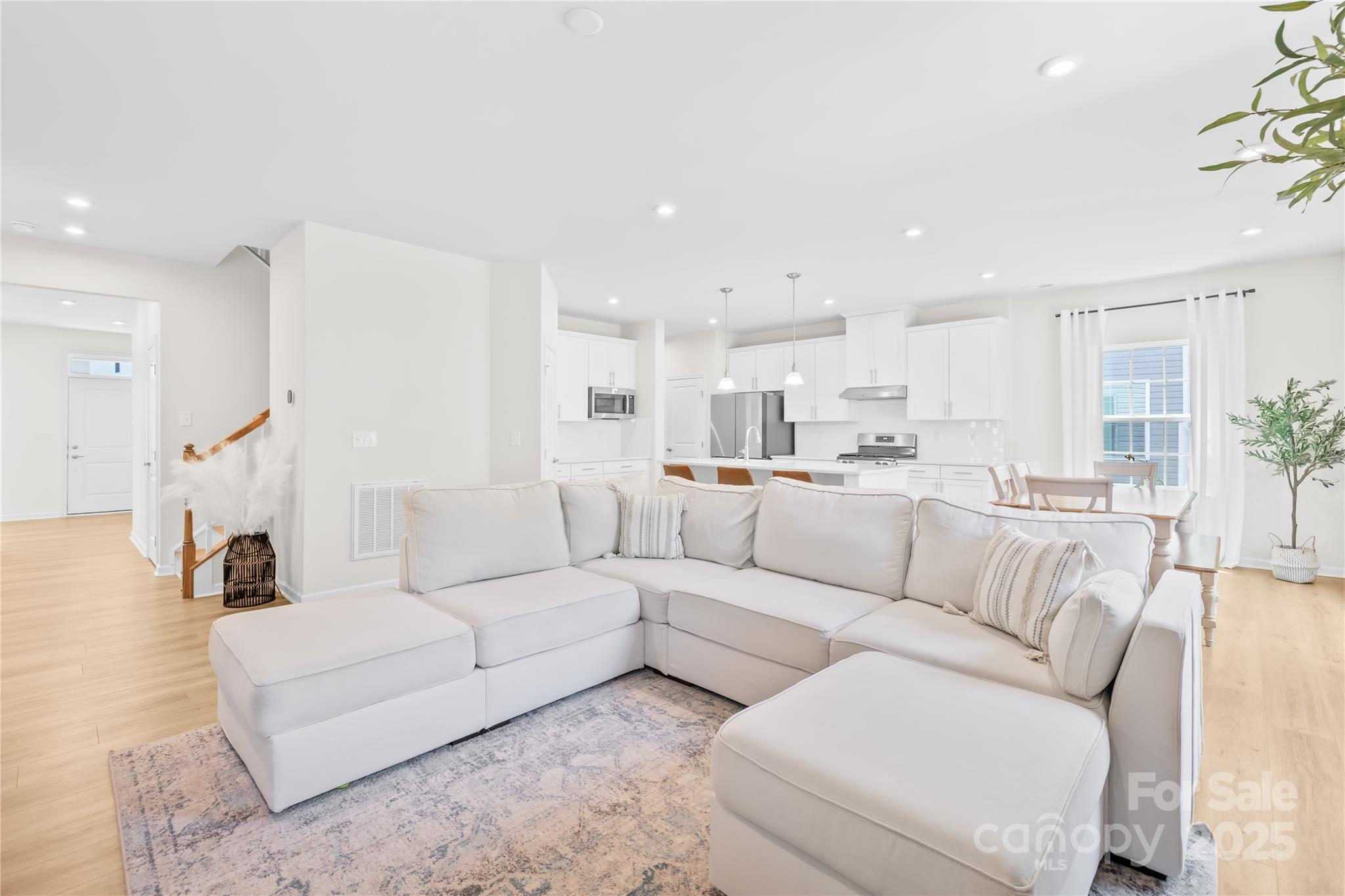3110 Streamside Drive Davidson, NC 28036 - Photo 8 of 39 a living room with furniture white walls and white cabinets