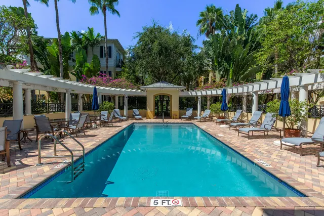 a view of a swimming pool with chairs