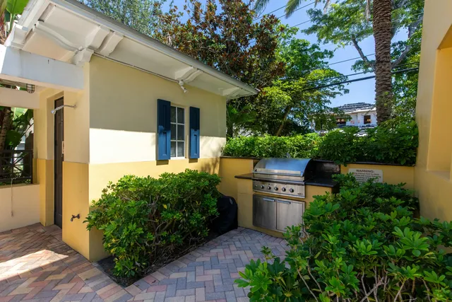 a view of a house with sitting area and garden