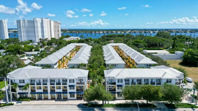 a view of multiple houses with a yard