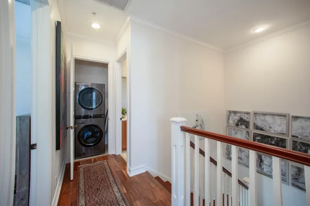 a view of hallway with washer and dryer